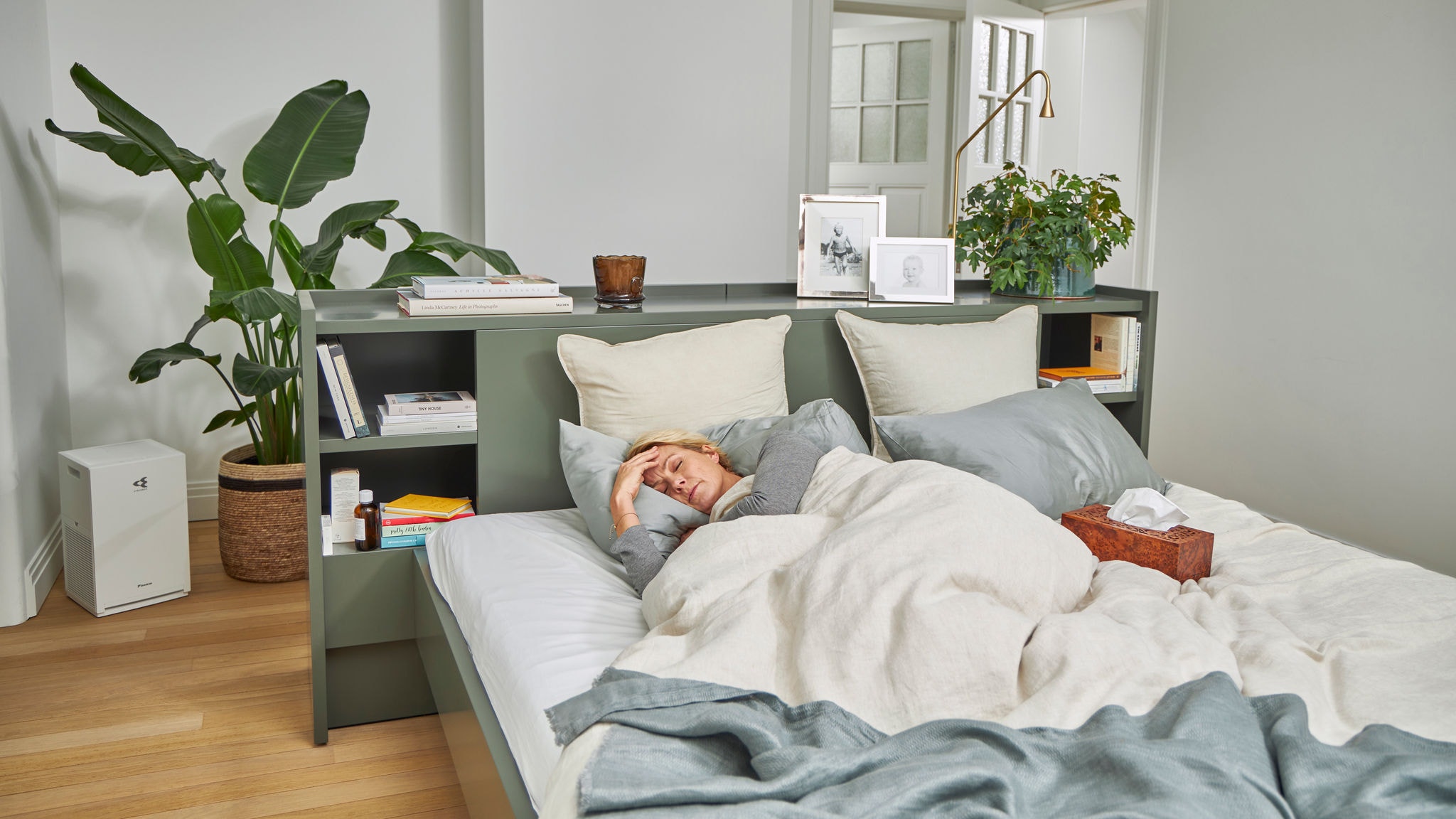 Woman with allergy sick in bed
